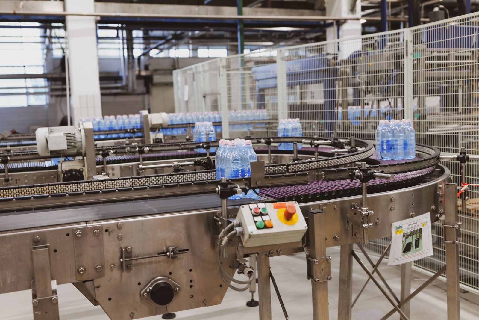 Bottles moving through an automated production line